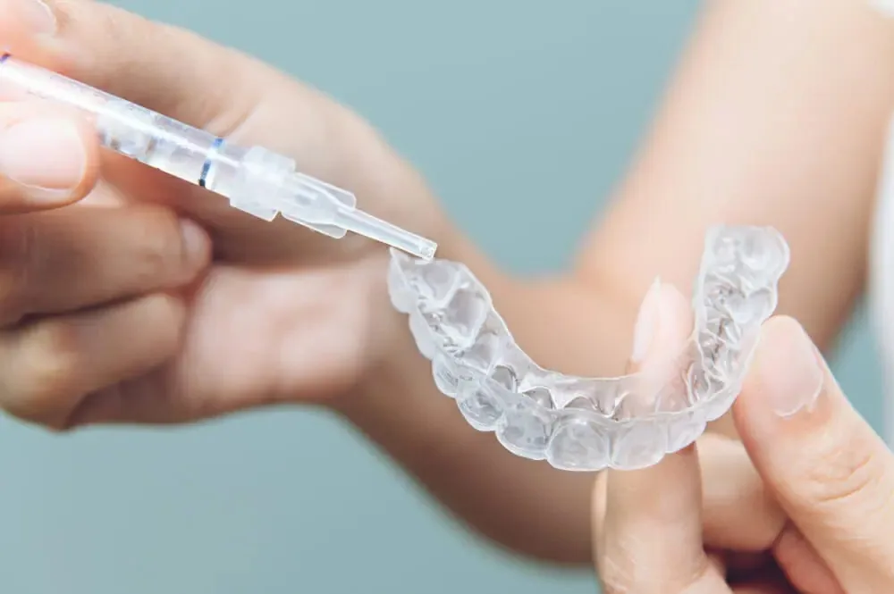 At-home teeth whitening kit with custom trays at Crossroads Dental Clinic in Dubai, Sheikh Zayed Road and Deira, safe professional teeth whitening at home