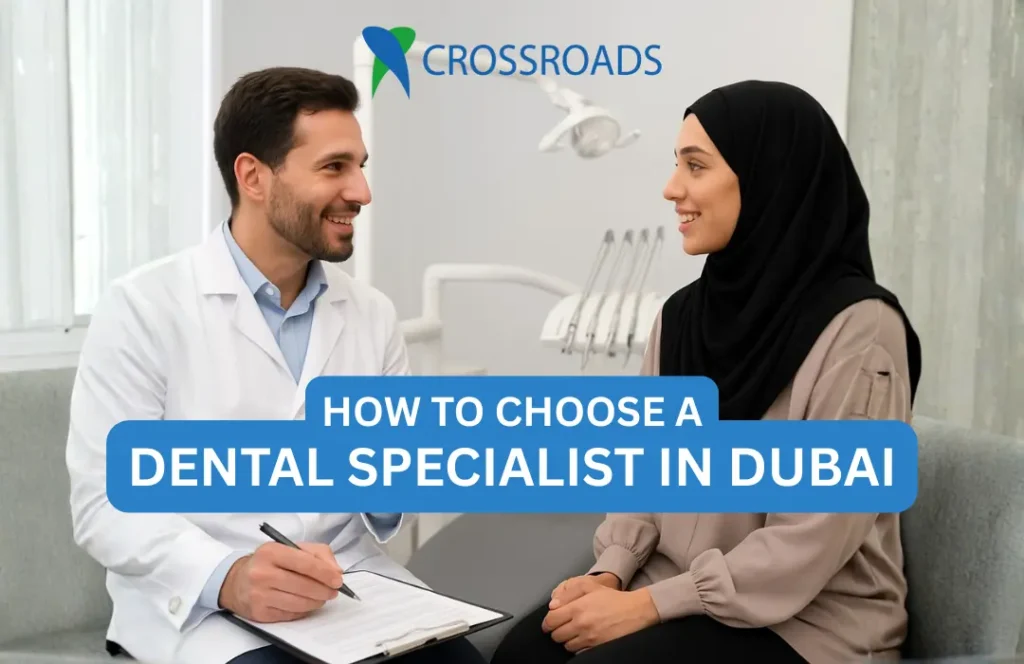A dental specialist in Dubai consulting with a patient at Crossroads Dental Clinic, showcasing professional and friendly care in a modern clinic setting.